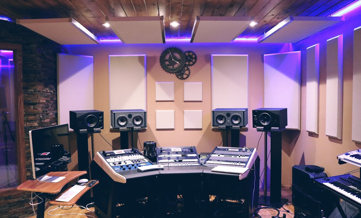 DJ laptop and sound equipment beside speakers